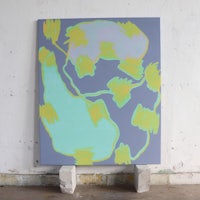 an abstract painting on a wall in a white room