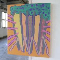 an abstract painting hanging on a wall