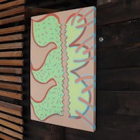 a piece of art hanging on a wall