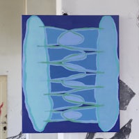 a painting of a blue and green painting hanging on a wall